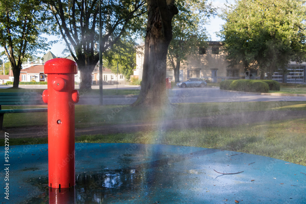 Misting station at the park with water droplet rainbow Misting station at the park with water droplet rainbow