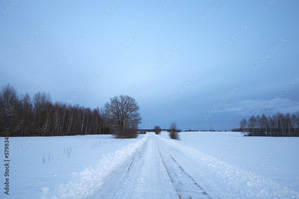 Sunset on a snowy road. Off-road on a snow-covered road. Sunset on a snowy road. Off-road on a snow-covered road.
