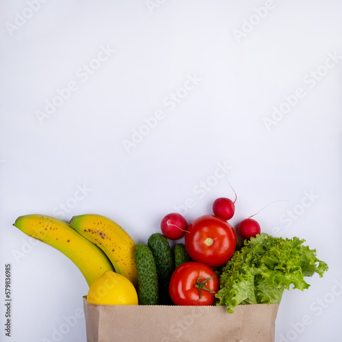 white background with space to insert text with a paper bag for products with vegetables