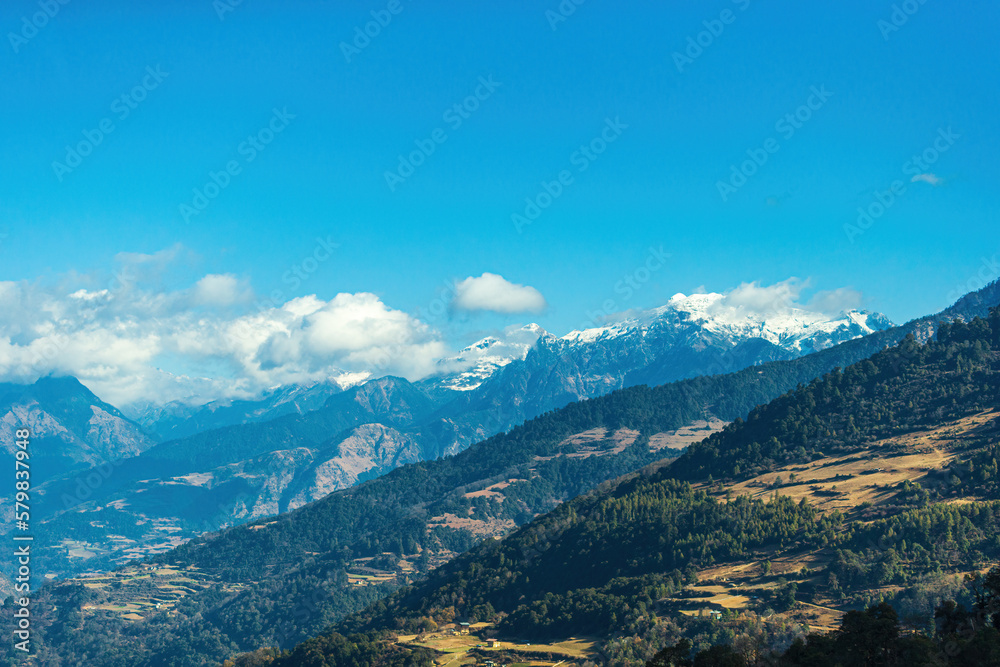 Mountain scebery of Bhutan under a blue sky