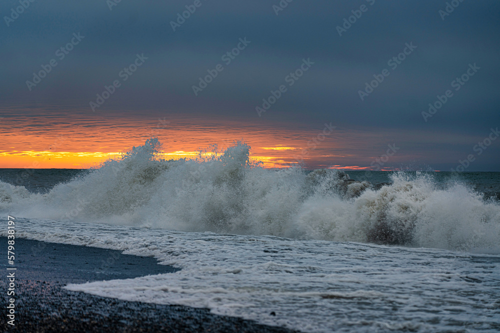 Storm on the sea at sunset