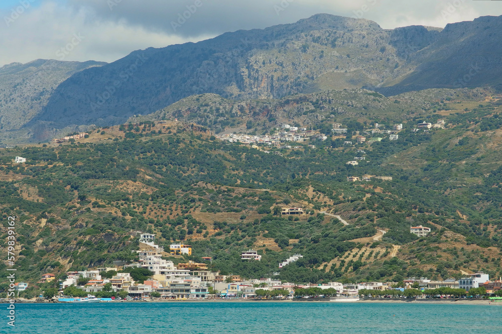 Village on the island of Crete, view into the mountains from the water