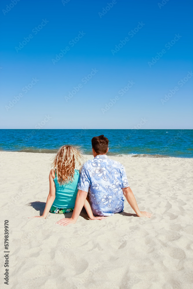 Happy beautiful couple on the sea in the summer on the nature