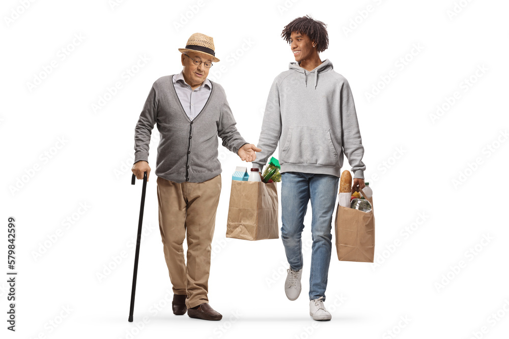 Full length portrait of an african american young man walking with a mature gentleman and carrying grocery bags Full length portrait of an african american young man walking with a mature gentleman and carrying grocery bags
