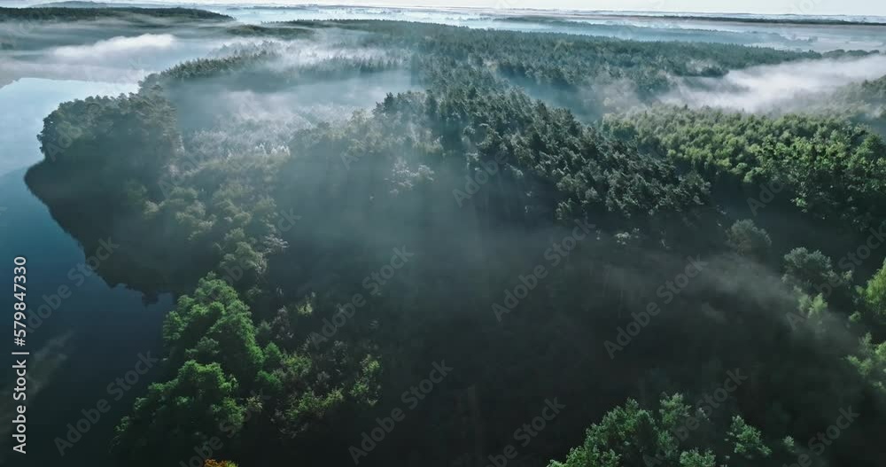 Lake and misty forest at sunrise in autumn. Lake and misty forest at sunrise in autumn.