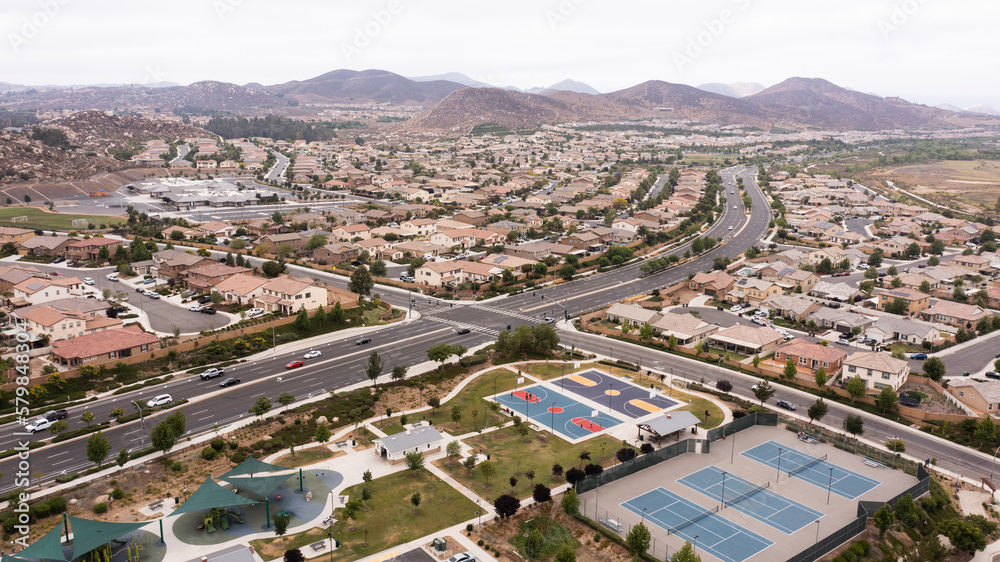 Aerial view of a sprawling neighborhood of family homes in Menifee, California, USA.