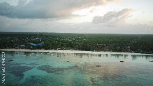 Unmanned aerial photography of the blue Indian Ocean waves tropical Zanzibar, Kizimkazi. photo