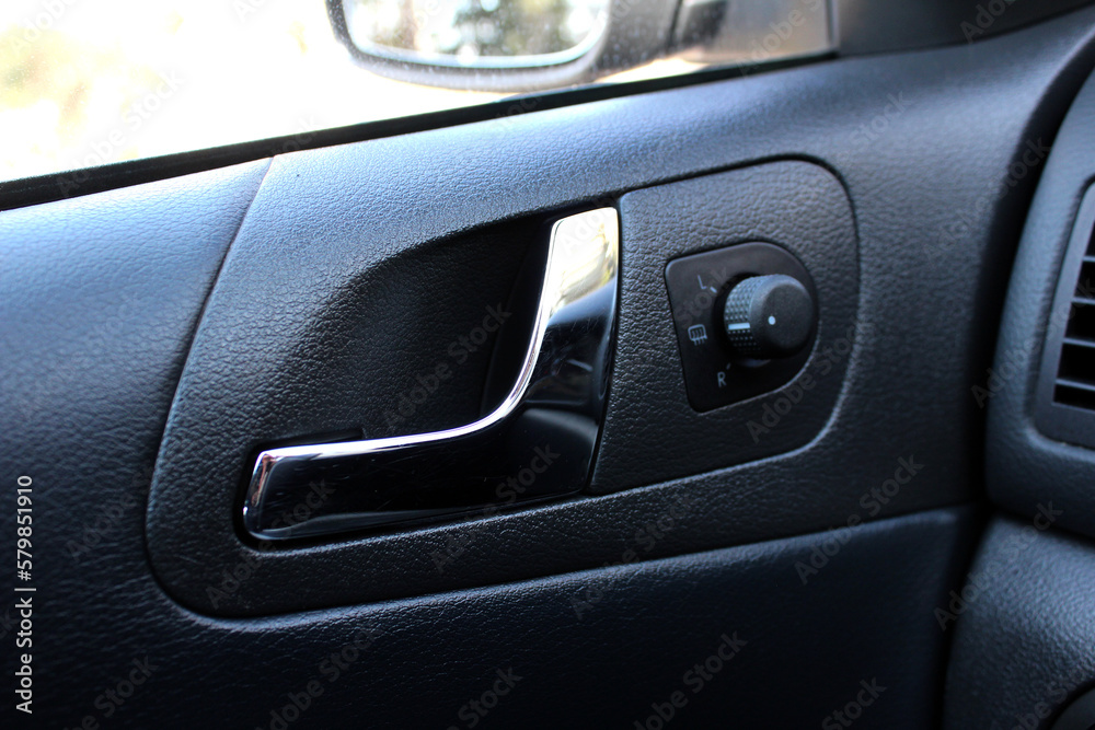 Car Inside Door Handle Interior. Door trim. Car mirror adjustment.