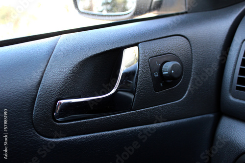 Car Inside Door Handle Interior. Door trim. Car mirror adjustment.