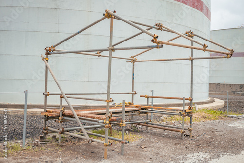 Power plant project activity for scafolding frame shelter. The photo is suitable to use for industry background, construction poster and safety content media.