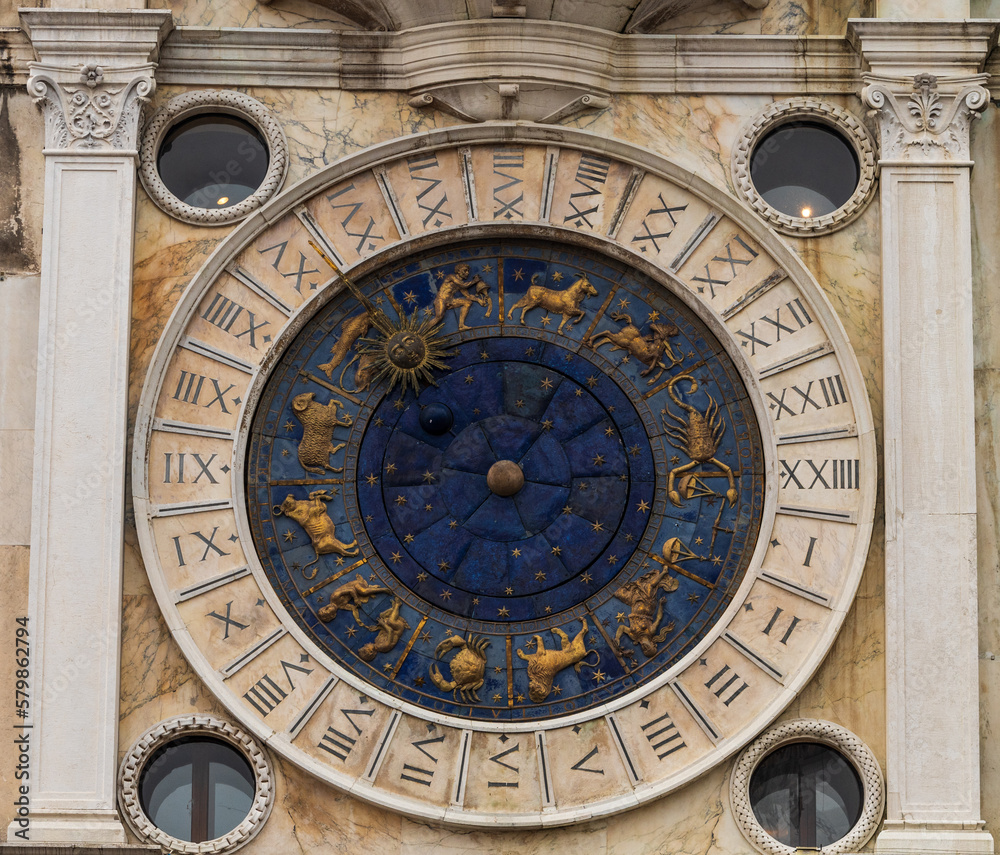 Magnificent tower with the astronomical clock. Stars, planets and zodiac. Astronomical clock in Piazza San Marco.