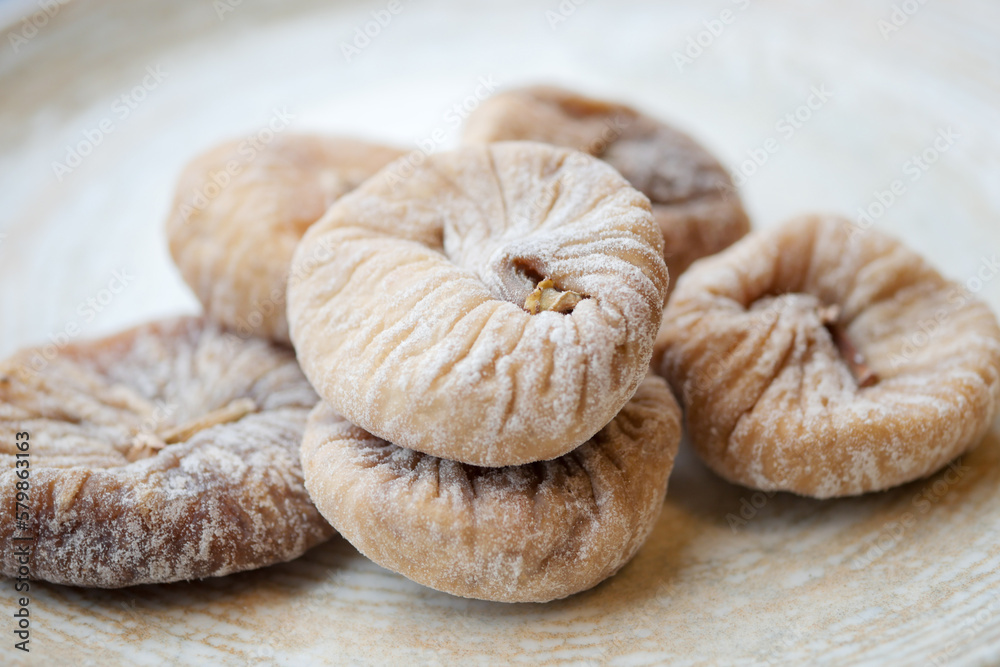 Dried fig fruit on on a plate on table Dried fig fruit on on a plate on table