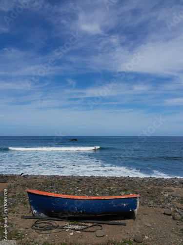 seascape with blue sky and boat in the foreground