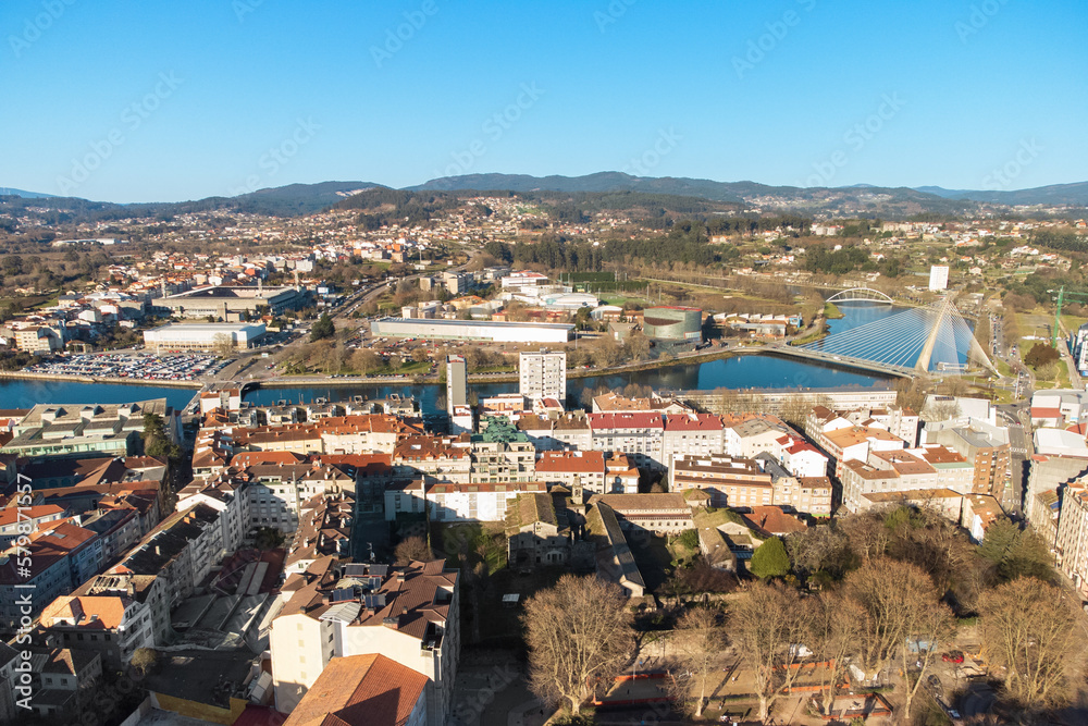 Obraz premium Aerial view of Pontevedra cityscape with a modern apartment buildings and sea bay, Galicia, Spain. High quality photo