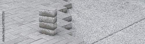 Valokuva building a sidewalk, laying interlocking pavers, banner with copy space