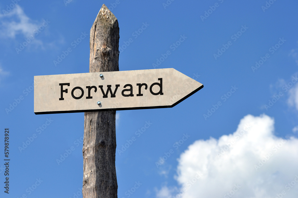 Forward - wooden signpost with one arrow, sky with clouds Forward - wooden signpost with one arrow, sky with clouds