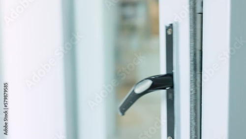 Leaving, fired and quitting business man hand opening door in office, company or startup and walking out or resigning. Closeup of executive laid off, retrenched and losing job after failed interview photo