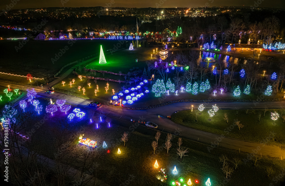 An Aerial View of a Large Christmas Drive Thru Display, with Multi Colored Lights, Seen at Night