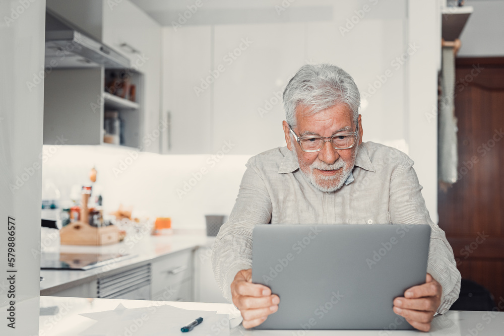 Happy excited old elderly man winner excited by reading good news looking at laptop, overjoyed senior mature grandfather watching game online celebrating goal bid bet win great result victory concept. Happy excited old elderly man winner excited by reading good news looking at laptop, overjoyed senior mature grandfather watching game online celebrating goal bid bet win great result victory concept.