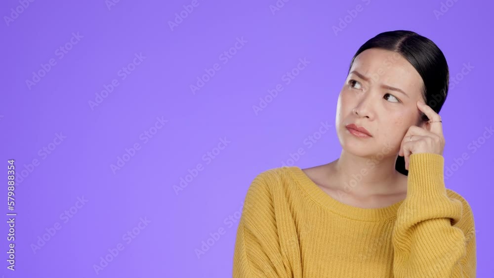 Asian woman, thinking and wondering on mockup contemplating against a purple studio background. Isolated thoughtful female in wonder, thought or think for solution or problem solving with copy space Asian woman, thinking and wondering on mockup contemplating against a purple studio background. Isolated thoughtful female in wonder, thought or think for solution or problem solving with copy space