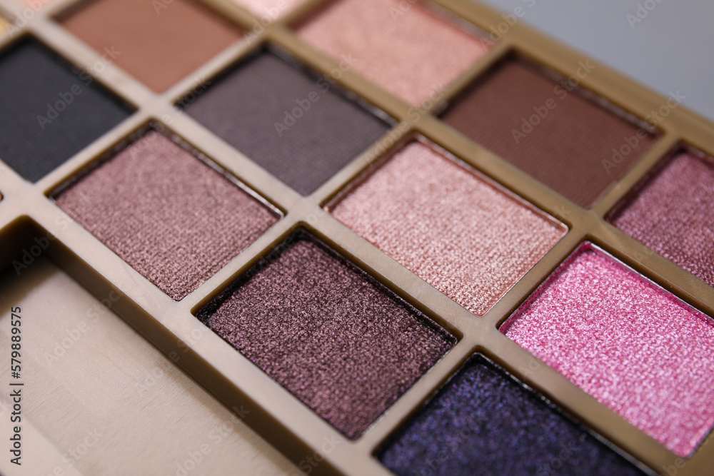 Fototapeta premium Beautiful eyeshadow palette as background, closeup. Professional cosmetic product