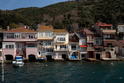 View of residential buildings in the fishing village of Kanadolu Kavagi on the shore of the Bosphorus Strait on a sunny day, Istanbul, Turkey