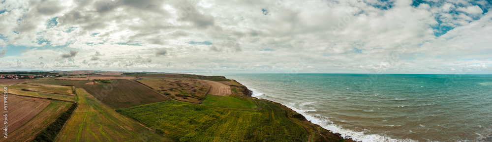 Picturesque panoramic landscape on the cliffs. Aerial panorama of coastal cliffs of France. Picturesque panoramic landscape on the cliffs. Aerial panorama of coastal cliffs of France.
