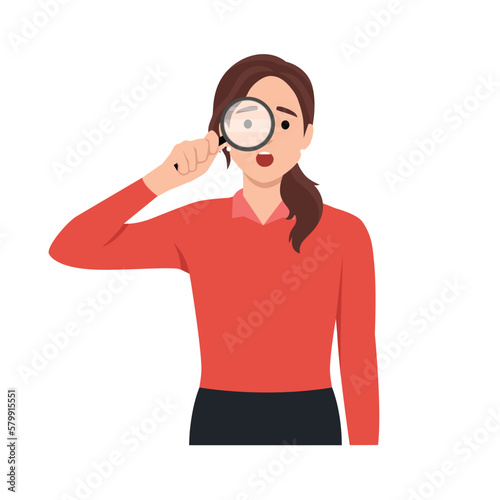 Young woman using magnifying glass and pointing finger. Searching internet data concept.