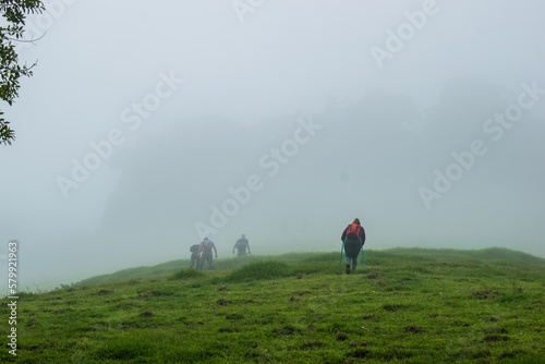 person walking in the fog