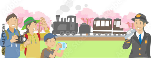 Fototapeta Naklejka Na Ścianę i Meble -  桜並木を走る蒸気機関車に乗る親子