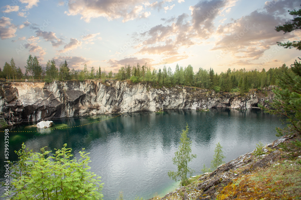 Spectacular landscape of cloudy sunset and cold blue mountain river Spectacular landscape of cloudy sunset and cold blue mountain river