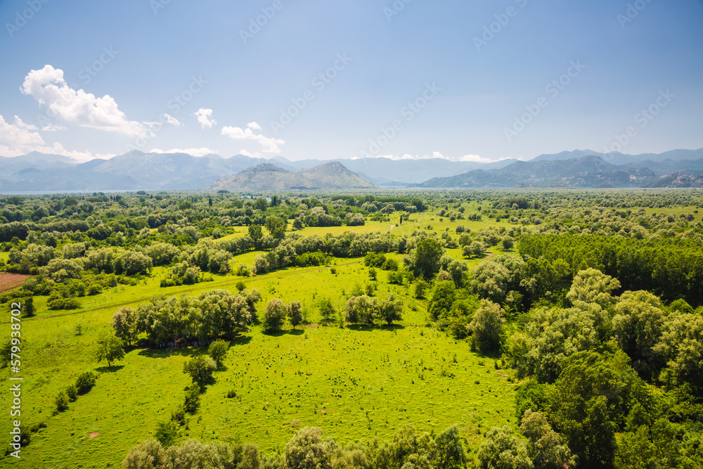 A breathtaking view from above of the green valley from Fortress Zabljak Crnojevica. Skadar Lake National Park, Montenegro, Europe.