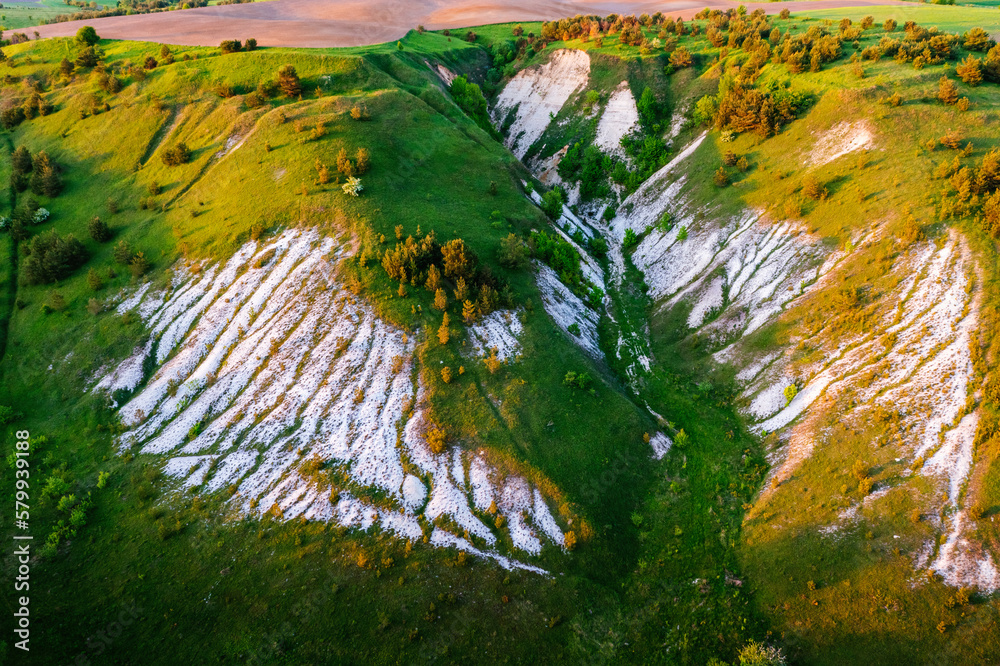 Green hills and a landslide with chalk deposits. Location place Ukraine, Europe.