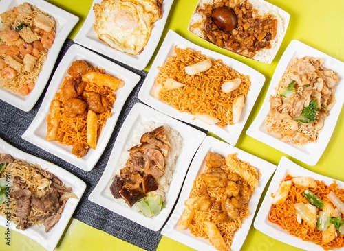 Assorted Stir-fried Instant Noodles with pork, beef, shrimp, Korean Cheese Fried Chicken, Braised Rice with Pork and Soy Sauce, pilaf and polao served in bowl isolated on table top view of taiwan food