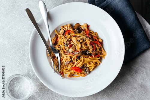 Fototapeta Naklejka Na Ścianę i Meble -  asian wheat noodles with chicken and vegetables. restaurant menu