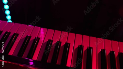 synthesizer piano, close up, colored lights