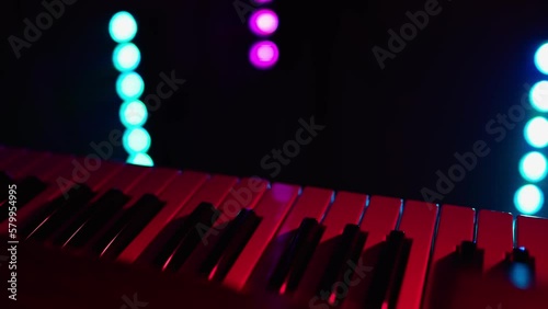 synthesizer piano, close up, colored lights