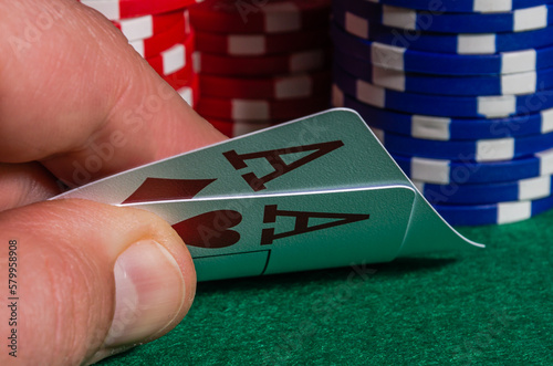 Four ace cards on the background of poker chips in a casino