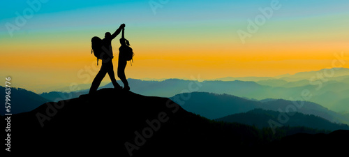 Silhouette of hikers couple mountains forest woods in the morning, landscape panorama, hiking adventure travel sucess background