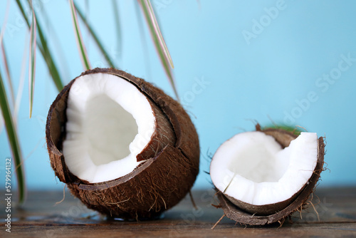 Close-up of coconut on wooden table against clear sky photo