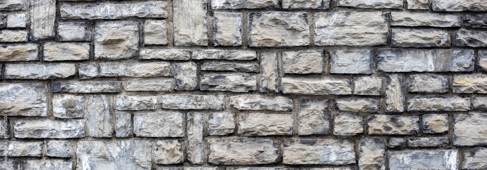 Fototapeta premium Natural grey stone brick wall texture background banner