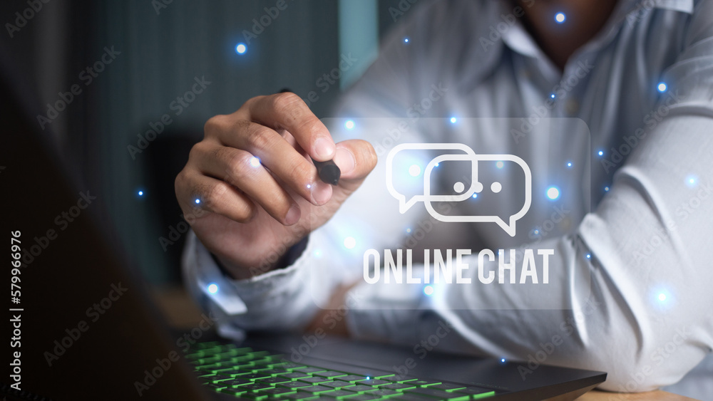 Naklejka premium men's hand typing on keyboard laptop with mobile smartphone, Live Chat Chatting on application Communication Digital Web and social network Concept