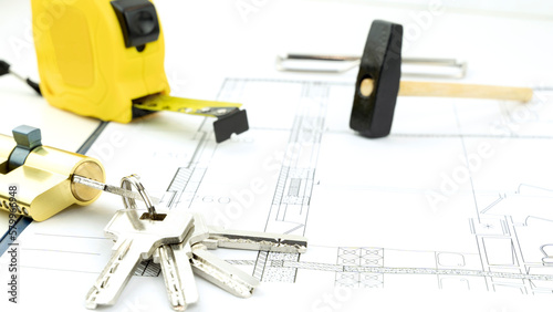 House keys and roulette on the drawings. the concept of construction and purchase of new housing