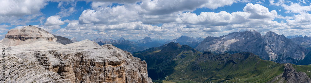 Sass Pordoi, Italy. Amazing view of mountains and peaks from the top of Sass Pordoi. Relaxing context. Traditional Alpine or Dolomites landscape. Touristic destination. Summer time
