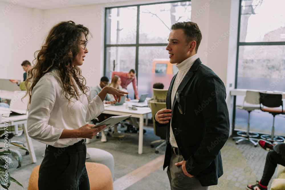 Two business colleagues talking Two business colleagues talking
