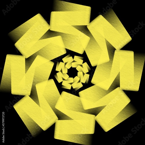 Yellow ribbon in circular pattern design on black background 