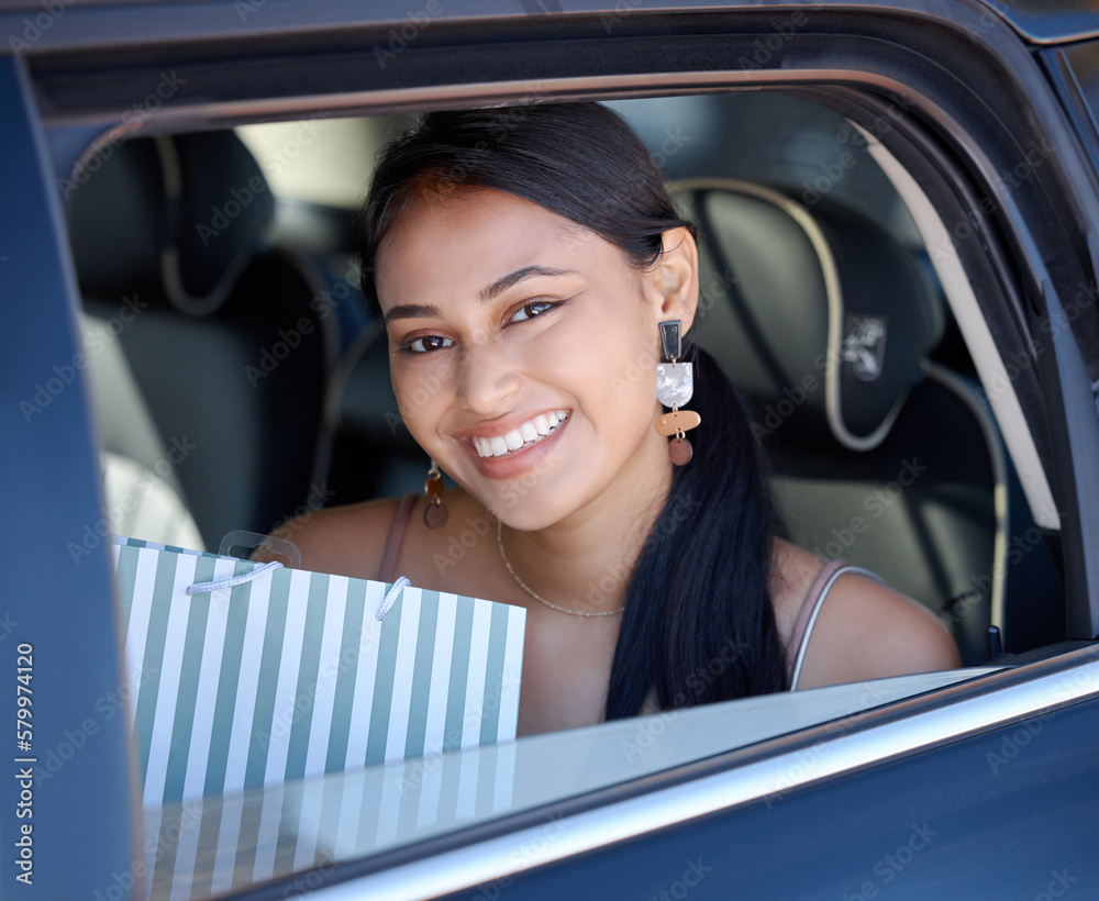 Shopping, happy and portrait of a woman in a cab for transportation after retail in the city. Smile, happiness and a girl with bags from fashion, store or boutique in a taxi car for transport