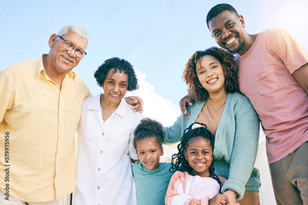 Hug, happy and portrait of an interracial family with a smile, happiness and care on the lawn. Looking, diversity and parents, grandparents and children with love, smiling and bonding in the garden Hug, happy and portrait of an interracial family with a smile, happiness and care on the lawn. Looking, diversity and parents, grandparents and children with love, smiling and bonding in the garden