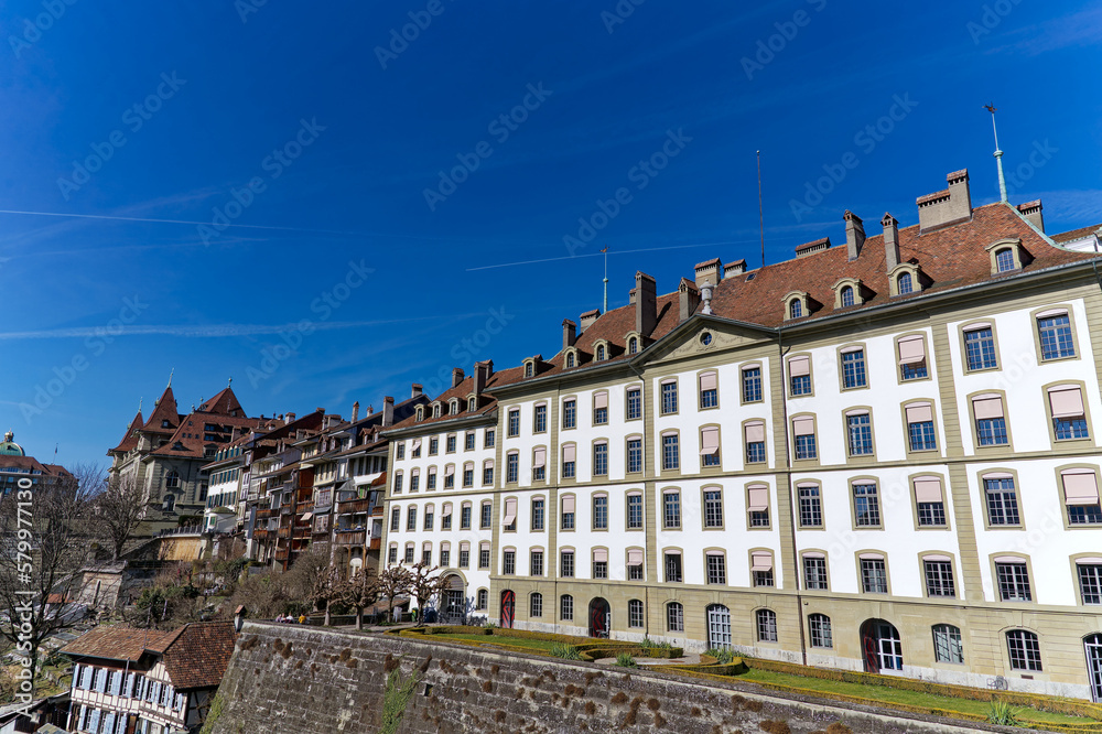 Scenic view of historic houses at the old town seen from Minster Terrace at the Swiss City of Bern on a sunny winter day. Photo taken February 21st, 2023, Bern, Switzerland.