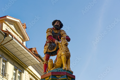 Samson sculpture with roman armor and lion on top of fountain at the old town of Bern, Switzerland. Photo taken February 24th, 2021, Bern, Switzerland. © Michael Derrer Fuchs